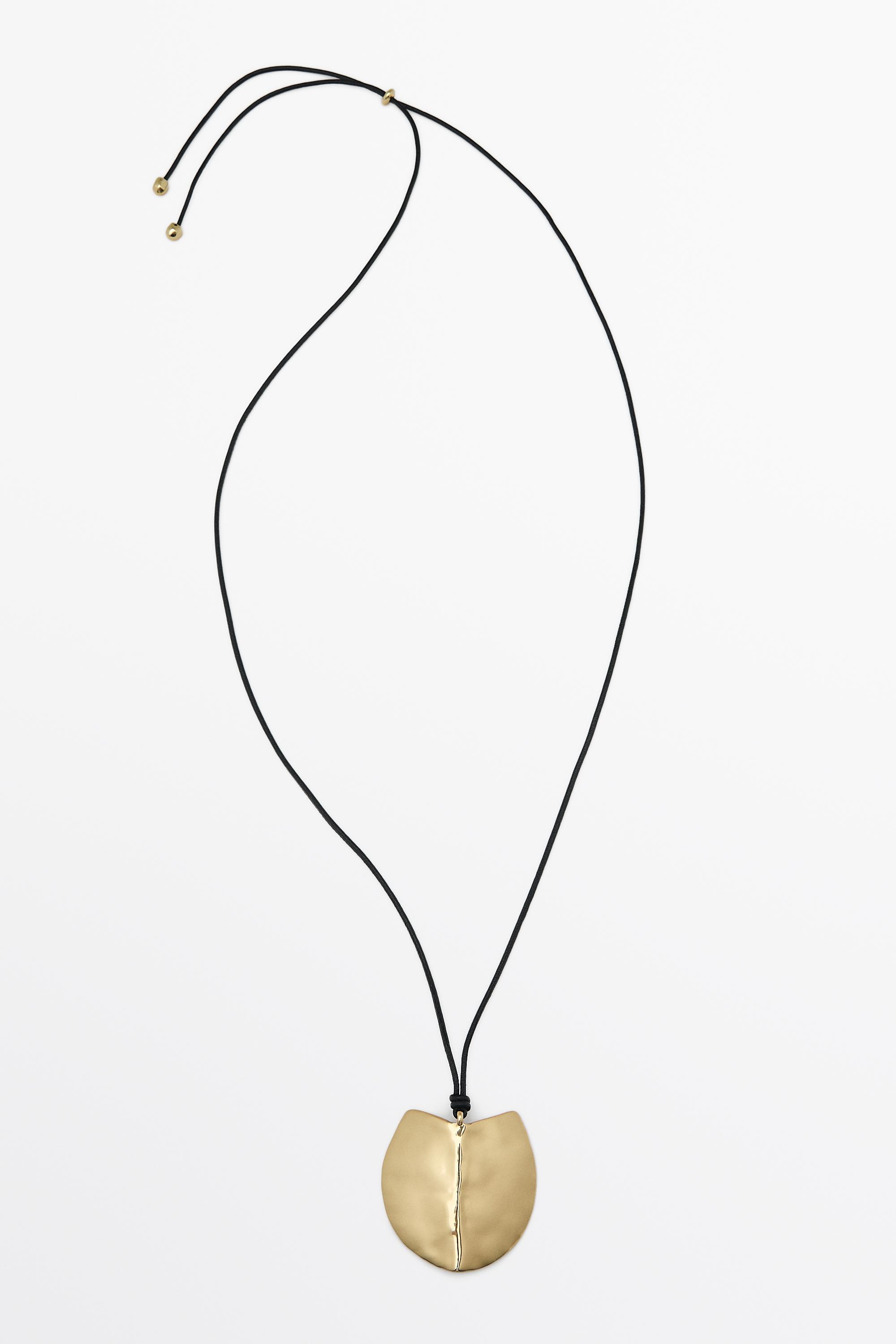 Long shield-effect piece necklace Golden