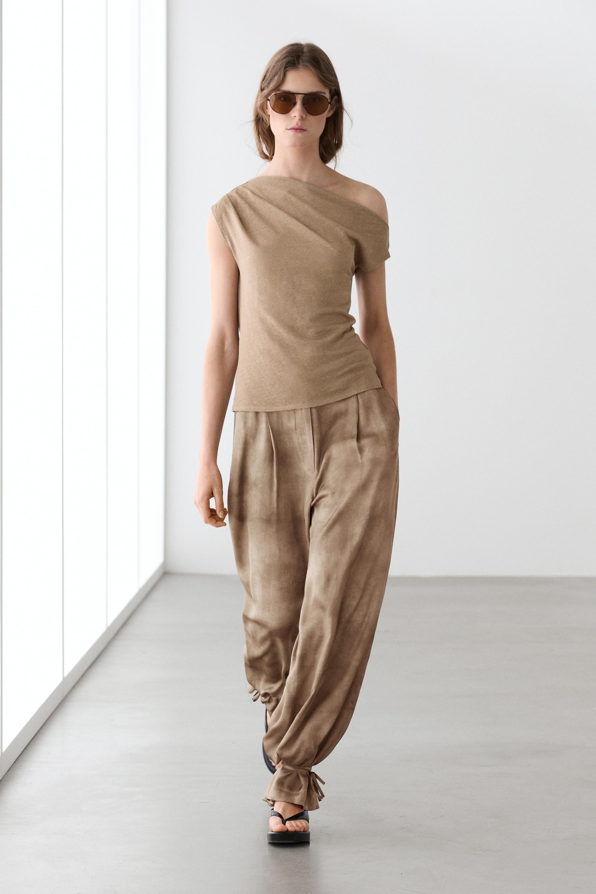 Flowing pants with tie-detail hem Beige