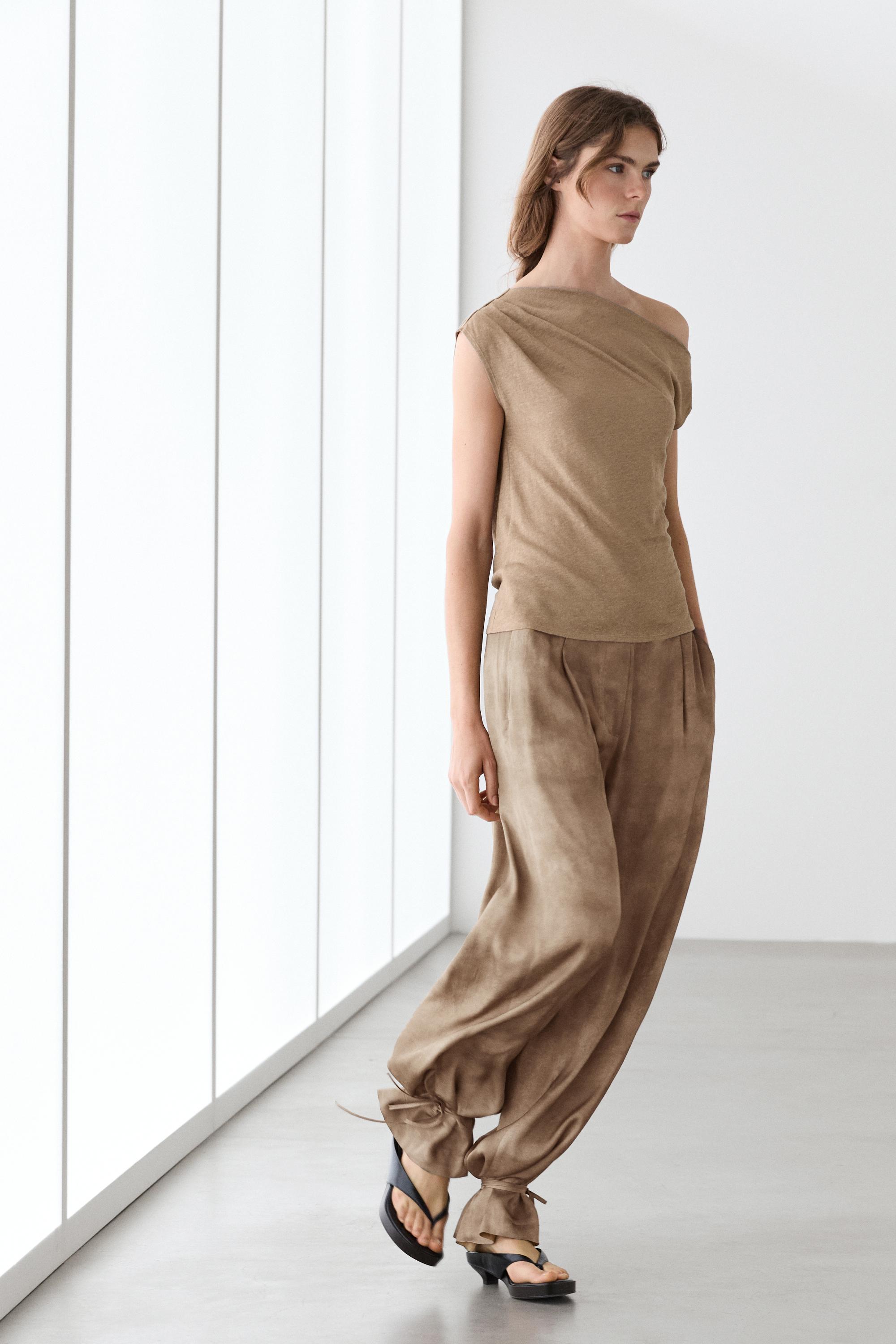 Flowing pants with tie-detail hem Beige