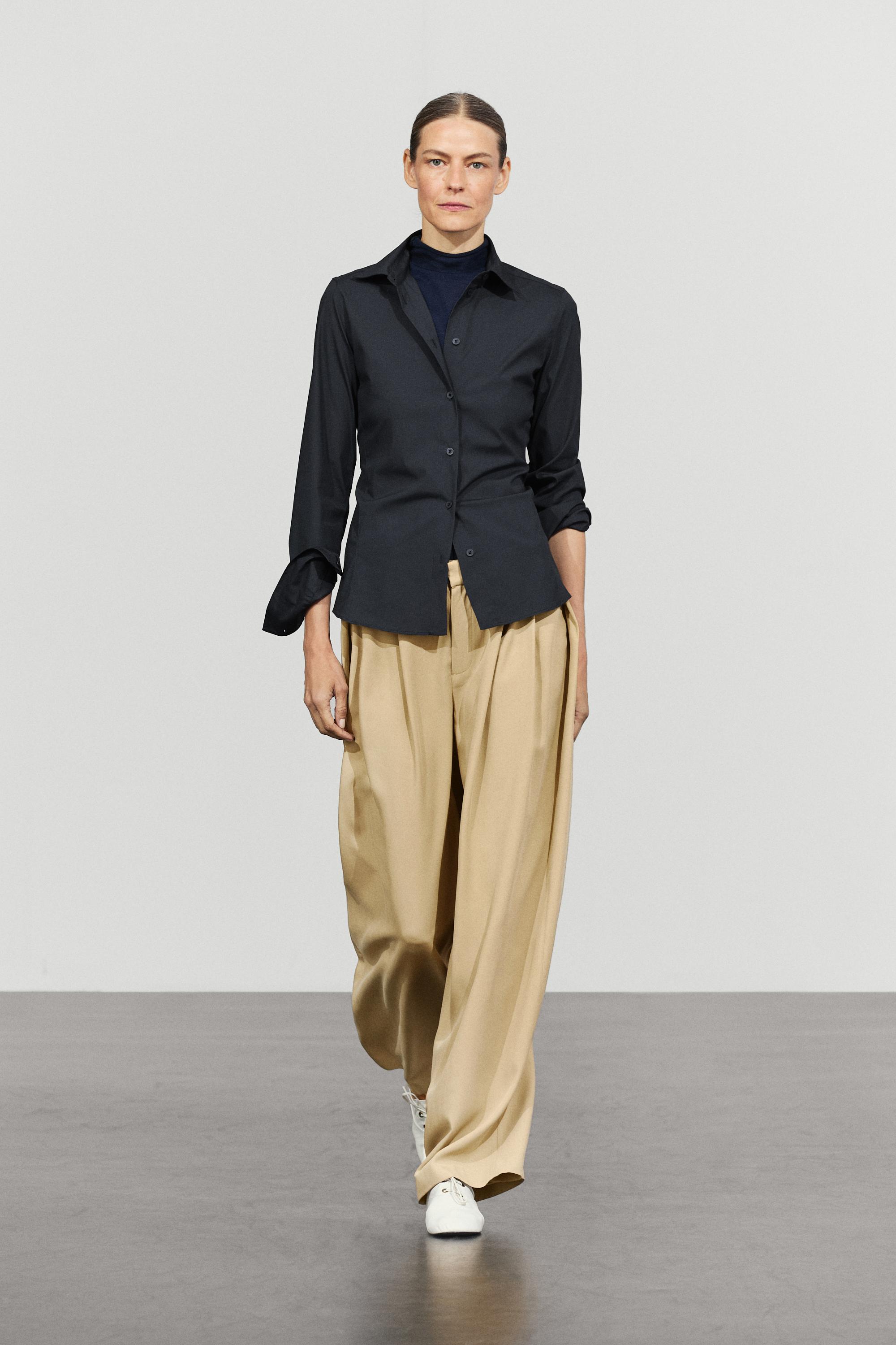 Flowing pleated pants with button detail Beige