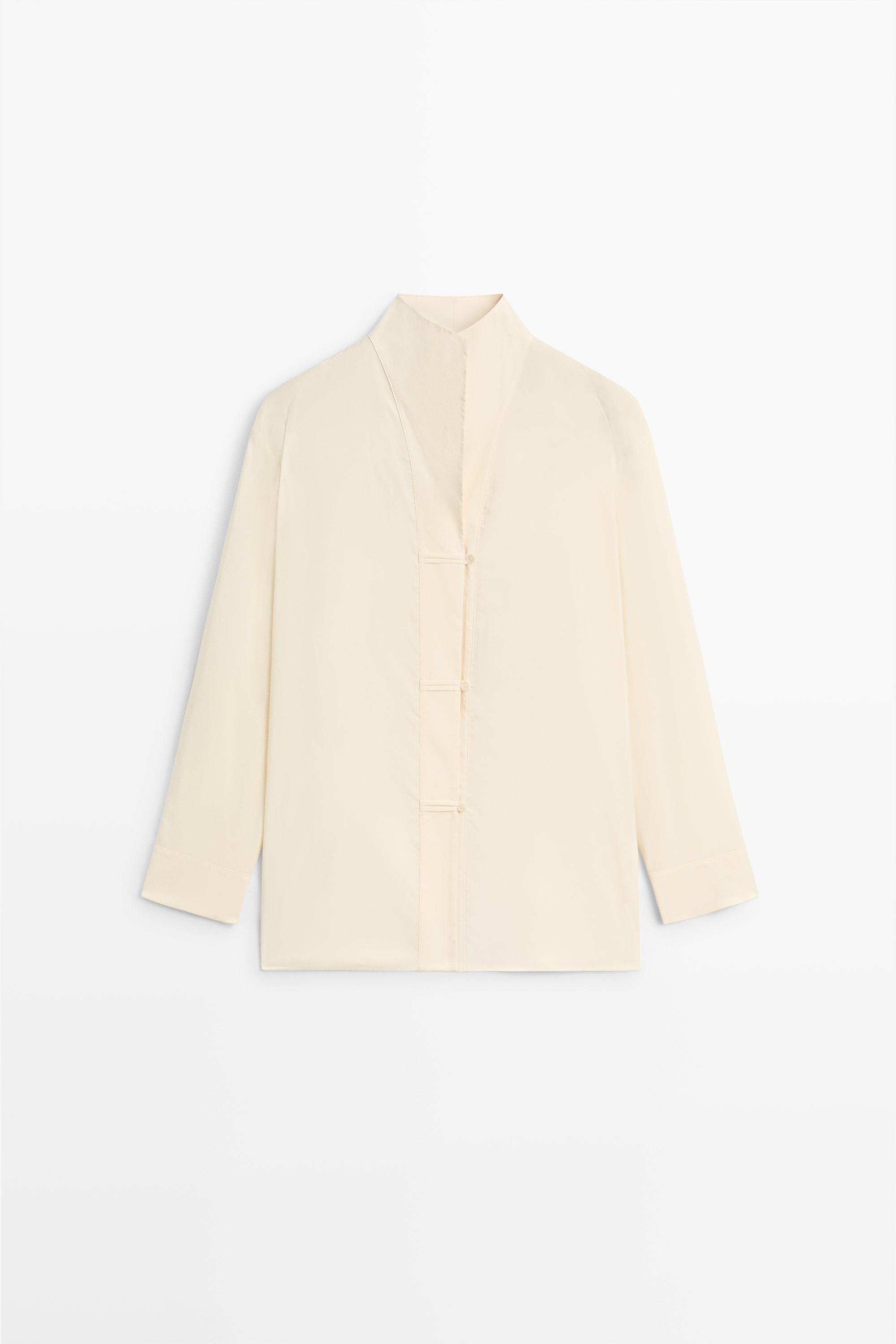 Flowing shirt with button details Cream