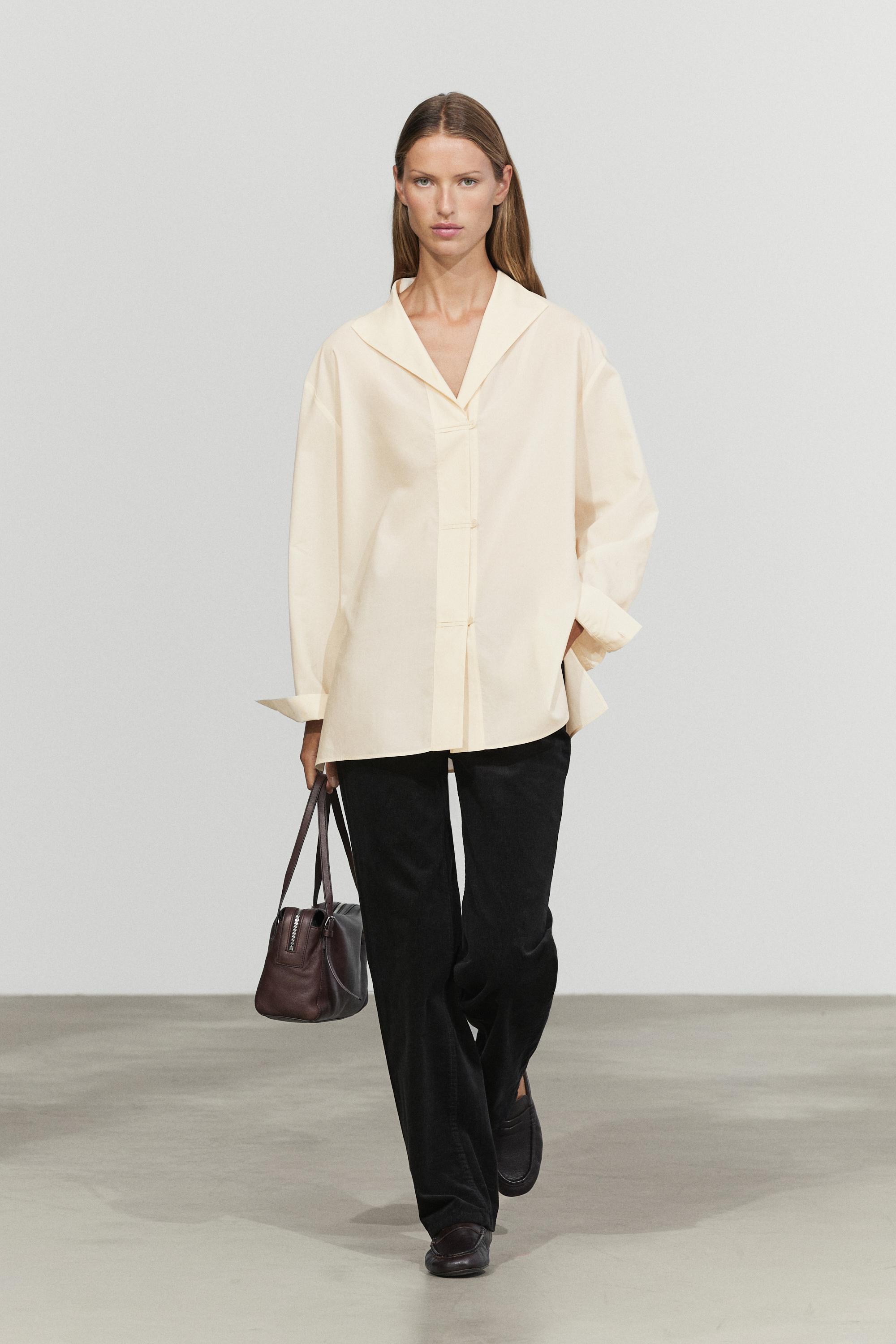 Flowing shirt with button details Cream