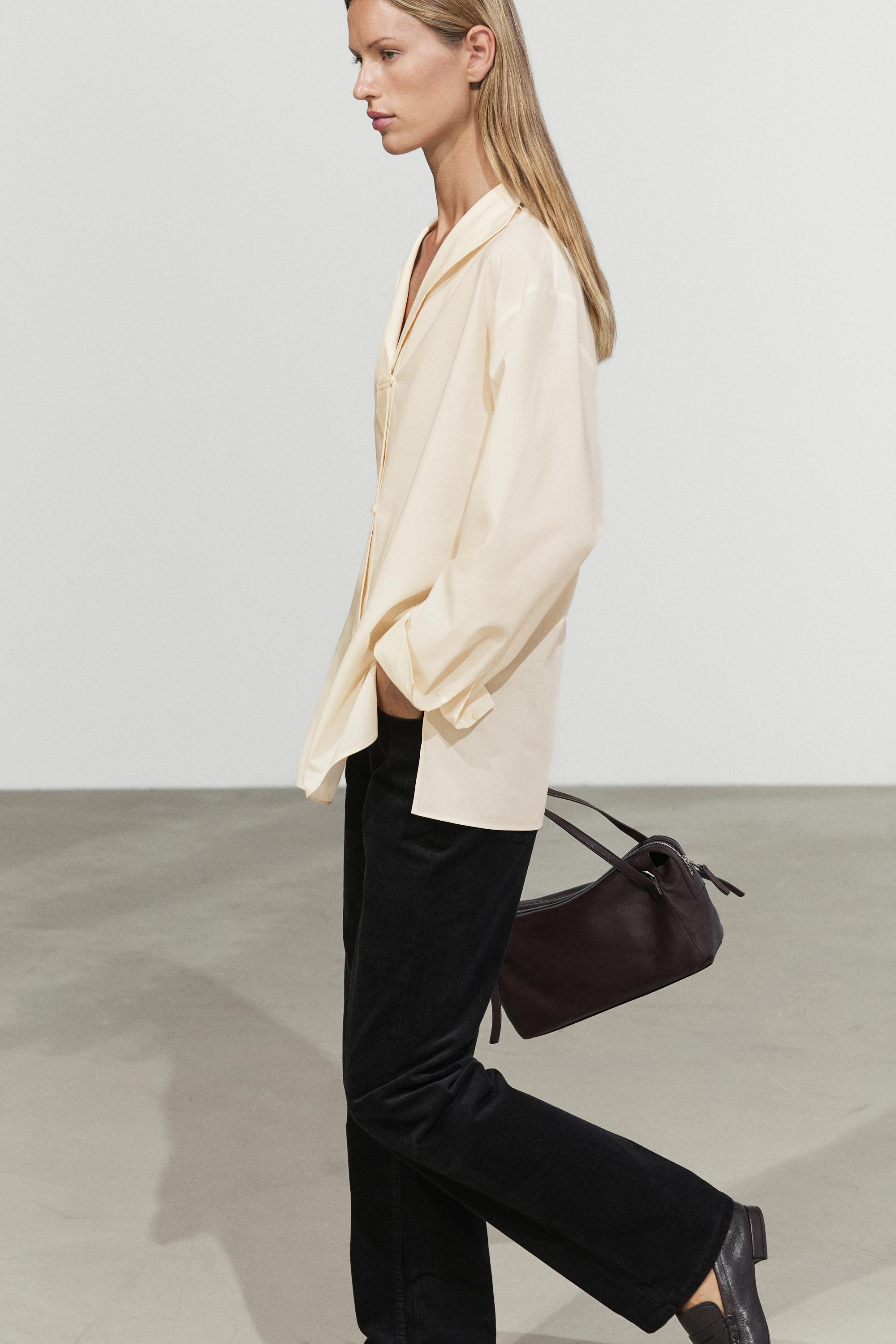 Flowing shirt with button details Cream