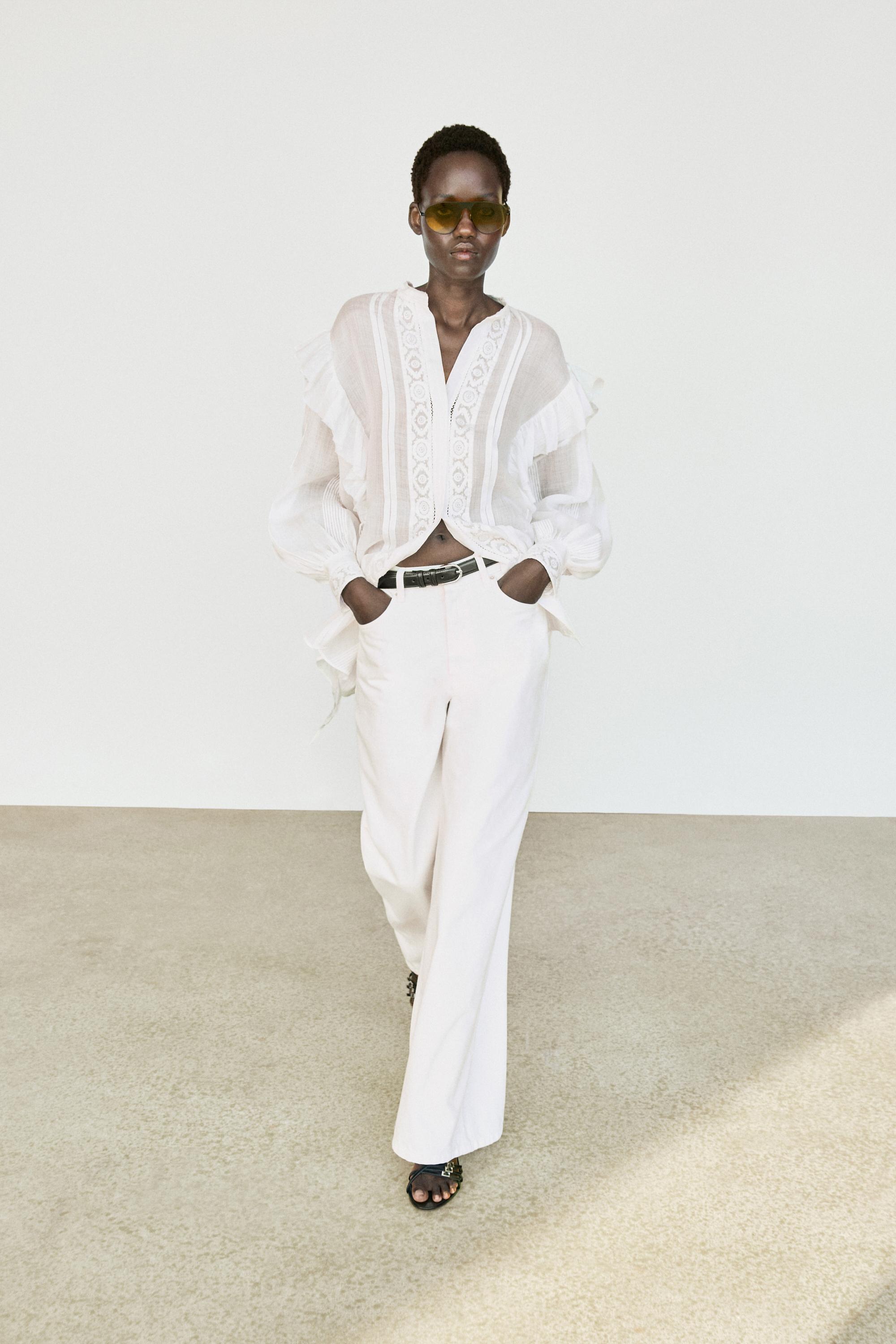 Stand collar blouse with embroidery and ruffles White