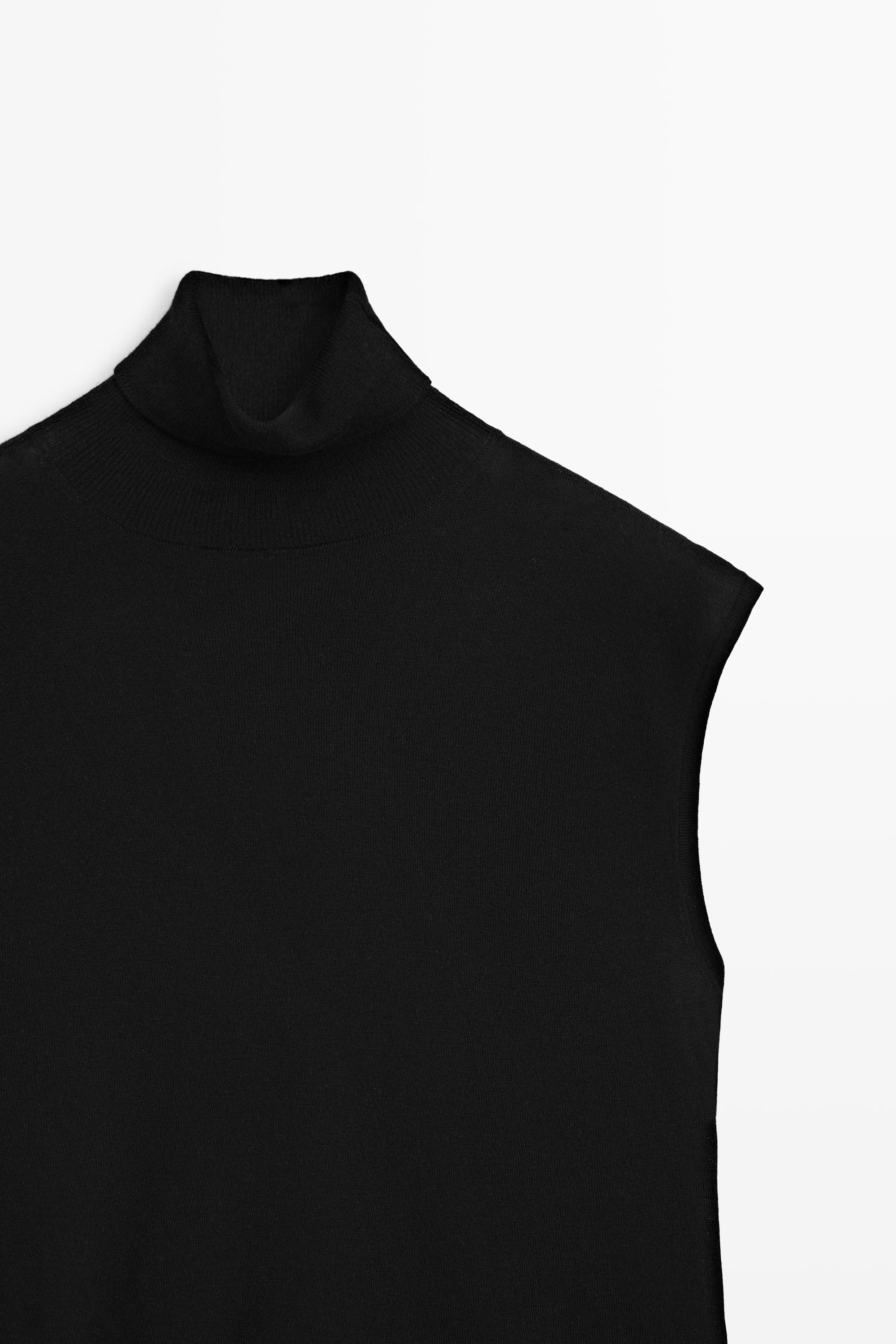 Asymmetric hem turtleneck top Black