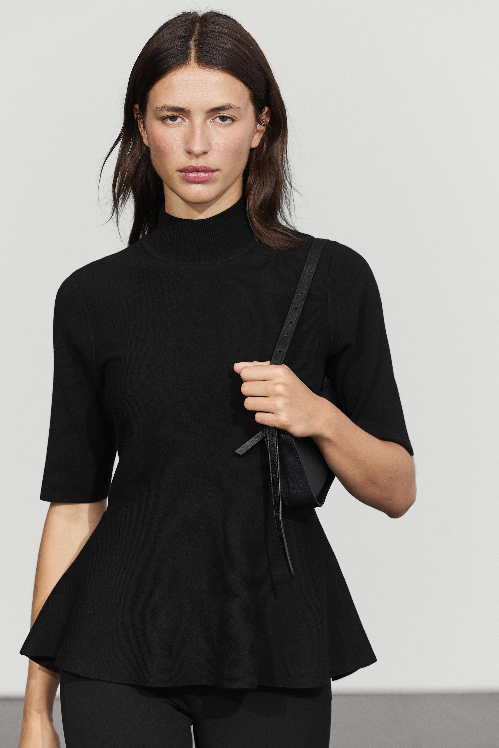 Peplum detail knit top Black